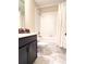 Bathroom with tub shower, toilet, and dark vanity at 791 Pebble Beach Dr, Davenport, FL 33896