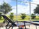 Enjoy relaxing on the lounge chairs by the pool and spa with a view of the community at 791 Pebble Beach Dr, Davenport, FL 33896