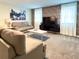 Living room with two sofas, coffee table, and tv at 791 Pebble Beach Dr, Davenport, FL 33896