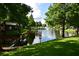 Serene pond with lush greenery and a fountain, offering a peaceful community view at 548 Pinebranch Cir, Winter Springs, FL 32708