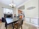 Dining room with a dark wood table, chairs, and a view of the kitchen at 1250 Shorecrest Cir, Clermont, FL 34711