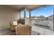 Screened balcony with wicker chairs and neighborhood view at 8831 Ribault Ave, Orlando, FL 32832