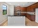 Modern kitchen with dark wood cabinets and granite countertops at 4701 Blackthorn Cir, Kissimmee, FL 34758