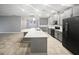 Modern kitchen with gray cabinets and a large island at 5408 Manchester Dr, St Cloud, FL 34771