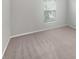 Simple bedroom with carpeted floors and a window at 5408 Manchester Dr, St Cloud, FL 34771