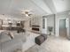 Open living room with a fireplace and kitchen views at 5408 Manchester Dr, St Cloud, FL 34771