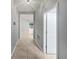 Clean hallway with tile floors and neutral walls at 5408 Manchester Dr, St Cloud, FL 34771
