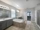 Spa-like bathroom with a large soaking tub and double vanity at 5408 Manchester Dr, St Cloud, FL 34771