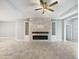 Spacious living room featuring a modern fireplace and built-in shelving at 5408 Manchester Dr, St Cloud, FL 34771