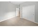 Well-lit bedroom with neutral walls and carpeted floors at 5408 Manchester Dr, St Cloud, FL 34771