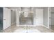Modern bathroom with a large walk-in shower and soaking tub at 5408 Manchester Dr, St Cloud, FL 34771