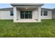 Covered patio with grassy backyard at 5408 Manchester Dr, St Cloud, FL 34771