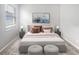 Bright bedroom with a queen-size bed and neutral decor at 5408 Manchester Dr, St Cloud, FL 34771