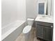 Clean bathroom with a tub, toilet and vanity at 5408 Manchester Dr, St Cloud, FL 34771