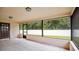 Bright screened porch with view of backyard at 3472 Country Walk Dr, Port Orange, FL 32129