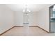 Bright dining room with tile floors and a chandelier at 3472 Country Walk Dr, Port Orange, FL 32129