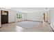 Bright living room with tile floors and a large window at 3472 Country Walk Dr, Port Orange, FL 32129