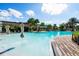 Resort-style pool with brick patio and umbrellas at 832 Longboat Dr, Davenport, FL 33896