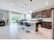 Modern kitchen with stainless steel appliances and an island at 8060 Cherrystone St, Leesburg, FL 34748