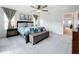 Spacious main bedroom with carpeted floors and en-suite bathroom at 8060 Cherrystone St, Leesburg, FL 34748