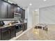 Modern kitchen with stainless steel appliances and dark brown cabinets at 3520 Saxony Ln, Saint Cloud, FL 34772