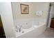 Bathroom featuring a large, relaxing jacuzzi tub at 8125 Resort Village Dr # 3514, Orlando, FL 32821