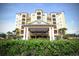 Resort-style building exterior with lush landscaping at 8125 Resort Village Dr # 3514, Orlando, FL 32821