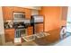 Modern kitchen with stainless steel appliances and granite countertops at 8125 Resort Village Dr # 3514, Orlando, FL 32821