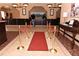 Elegant lobby with a red carpet and gold stanchions at 8125 Resort Village Dr # 3514, Orlando, FL 32821