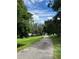 Scenic paved pathway leading to a tranquil lake at 836 Rosemere Cir, Orlando, FL 32835