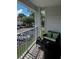 Small balcony with seating for two and view of parking lot at 11544 Westwood Blvd # 1325, Orlando, FL 32821