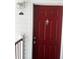 Red front door of a condo unit at 11544 Westwood Blvd # 1325, Orlando, FL 32821