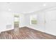 Bright living room with hardwood floors and window at 5351 E Johnson Ave, Haines City, FL 33844
