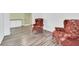 Cozy sitting area with two armchairs and wood floors at 5351 E Johnson Ave, Haines City, FL 33844