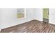 Bedroom with hardwood floors and a window at 5351 E Johnson Ave, Haines City, FL 33844
