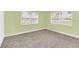 Bedroom with light green walls and carpet at 5351 E Johnson Ave, Haines City, FL 33844