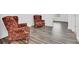 Relaxing sitting area with two armchairs and wood floors at 5351 E Johnson Ave, Haines City, FL 33844