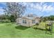 Cute yellow house with a yard and fence at 5351 E Johnson Ave, Haines City, FL 33844