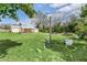 Fenced backyard with grassy area and shed at 5351 E Johnson Ave, Haines City, FL 33844