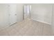 Simple bedroom with tile floors and white doors at 8742 Foley Dr, Orlando, FL 32825