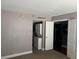 Stackable washer and dryer in a closet style laundry room at 151 E Washington St # 322, Orlando, FL 32801
