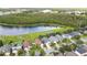 Aerial view of a neighborhood with lake access and various home styles at 1910 Hammock Moss Dr, Orlando, FL 32820