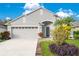 Attractive one-story home with two-car garage and landscaped yard at 1910 Hammock Moss Dr, Orlando, FL 32820