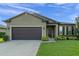 One-story house with a dark brown garage door at 3627 Vega Creek Dr, Saint Cloud, FL 34772