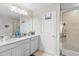 Double vanity bathroom with shower and linen closet at 1820 Holden Ridge Ln, Clermont, FL 34715