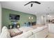 Spacious living room with sectional sofa and accent wall at 1820 Holden Ridge Ln, Clermont, FL 34715