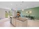 Modern kitchen with granite island and open layout at 1820 Holden Ridge Ln, Clermont, FL 34715