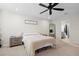 Guest bedroom with a full-size bed and ceiling fan at 1820 Holden Ridge Ln, Clermont, FL 34715