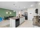 Modern kitchen with granite island and stainless steel appliances at 1820 Holden Ridge Ln, Clermont, FL 34715