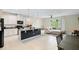 Open-concept kitchen and living area with island at 1820 Holden Ridge Ln, Clermont, FL 34715